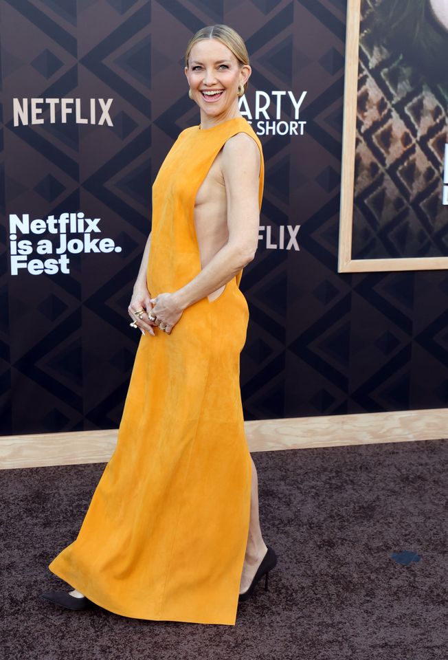 kate hudson orange dress Kate Hudson Turns Heads in a Saffron Dress With Deep Side Cutouts a  Surprising Back Detail