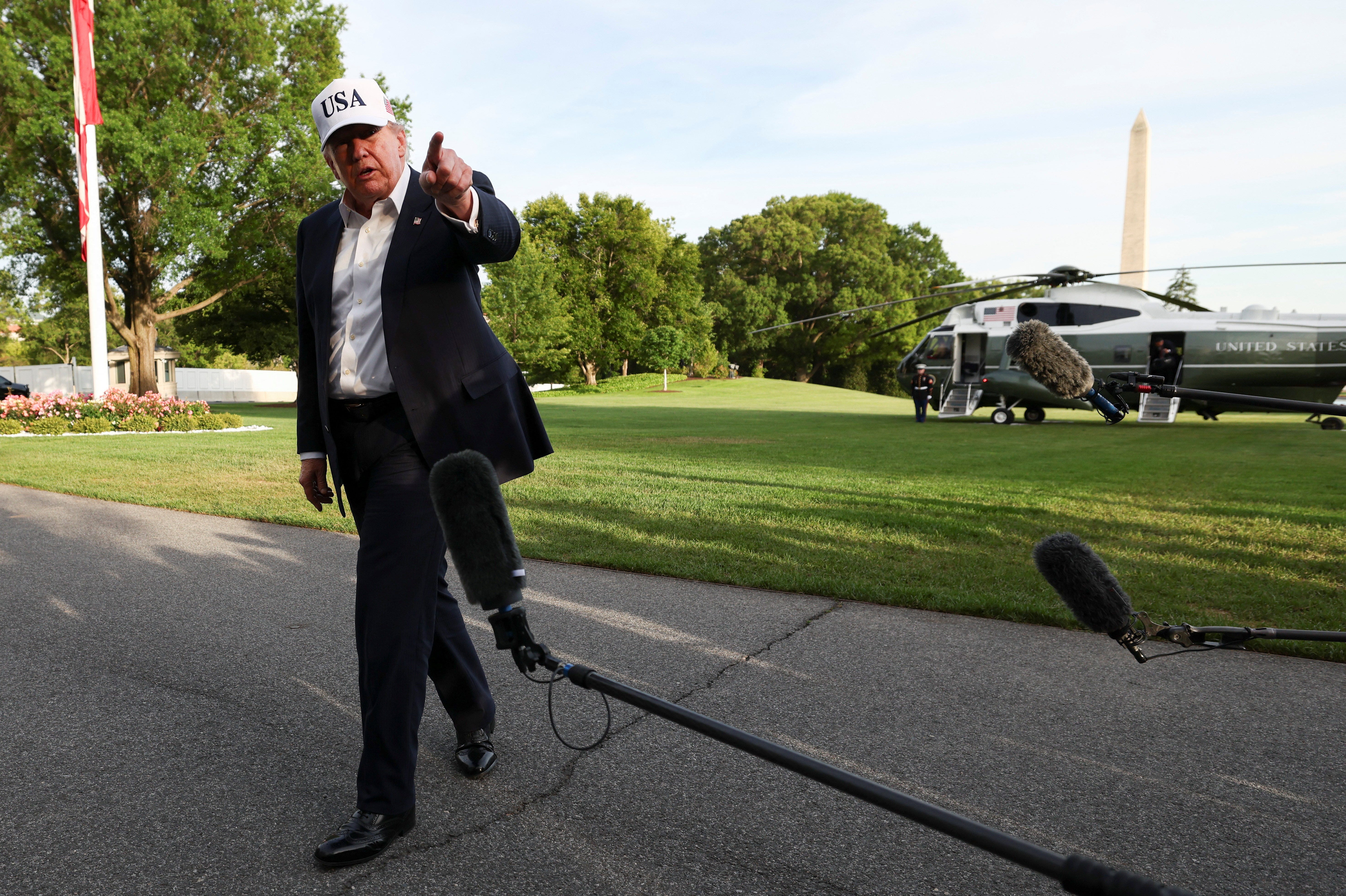 Trump approval rating sinks to term low in new poll amid Iran war - AOL