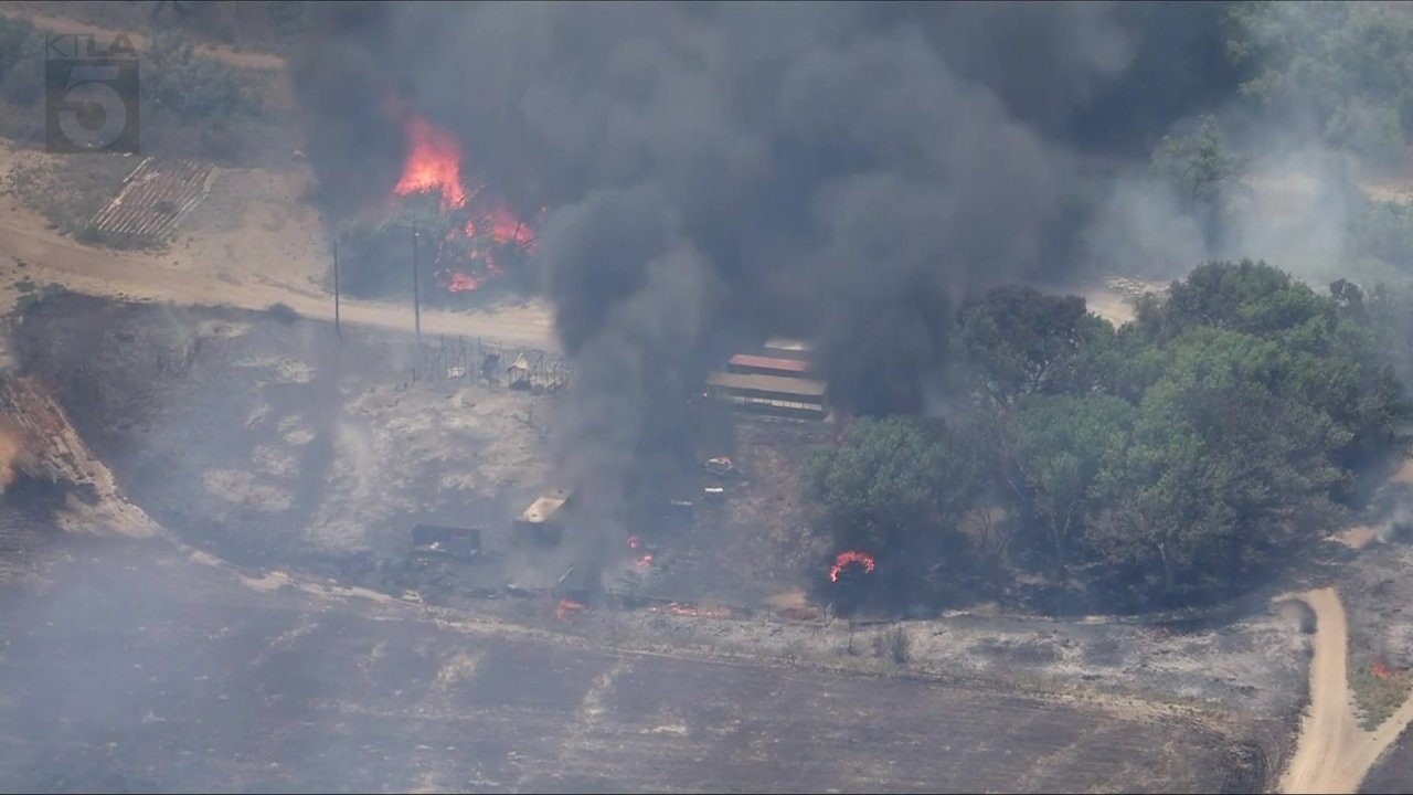 Crews battle brush fire burning structures in Riverside County - AOL