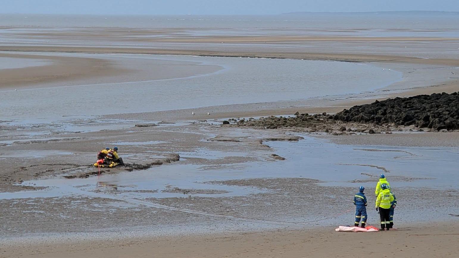 Man and his dog rescued after getting stuck in mud - AOL