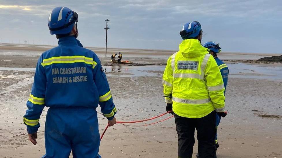 Man and his dog rescued after getting stuck in mud - AOL