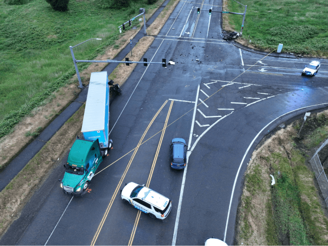 1 dead, 1 critically injured after car crashed into semi-truck, burst ...