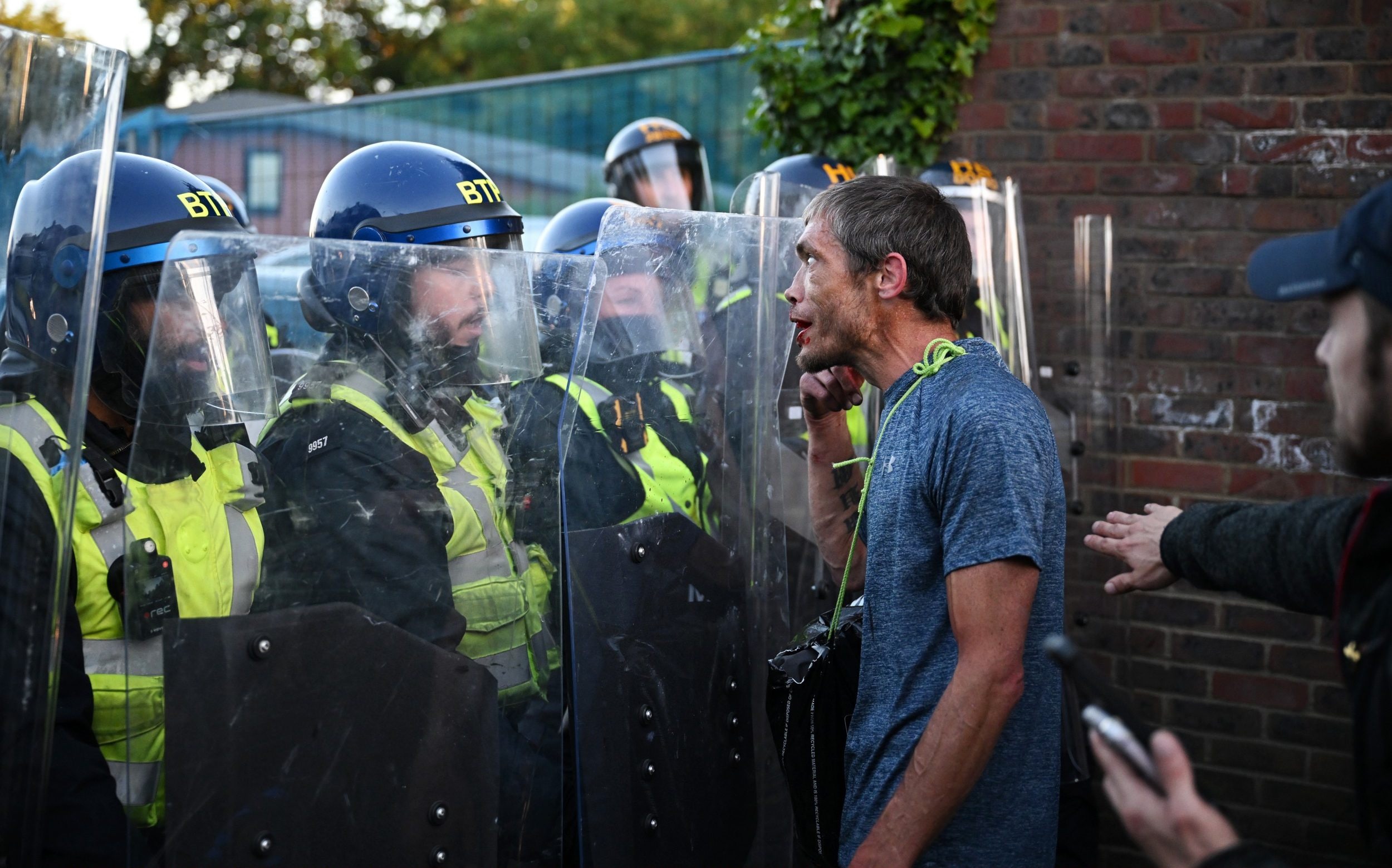 Henry Nowak protesters throw bricks and bottles at police - AOL