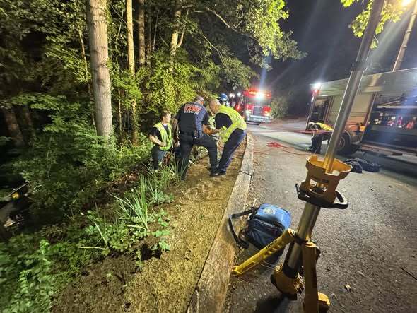 Driver rescued after car plunges down 40-foot embankment in WNC - AOL
