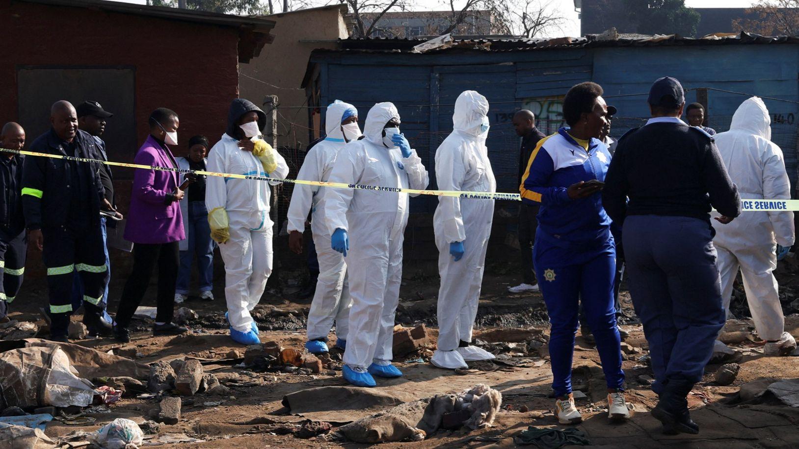 Manhunt under way in South Africa after 12 killed in mass shooting in ...