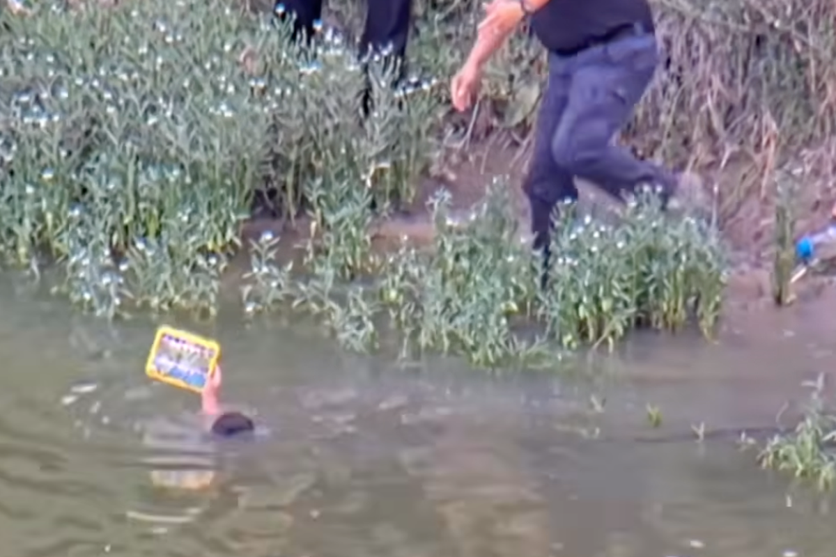 Cops save missing child from drowning after he wandered into river - AOL