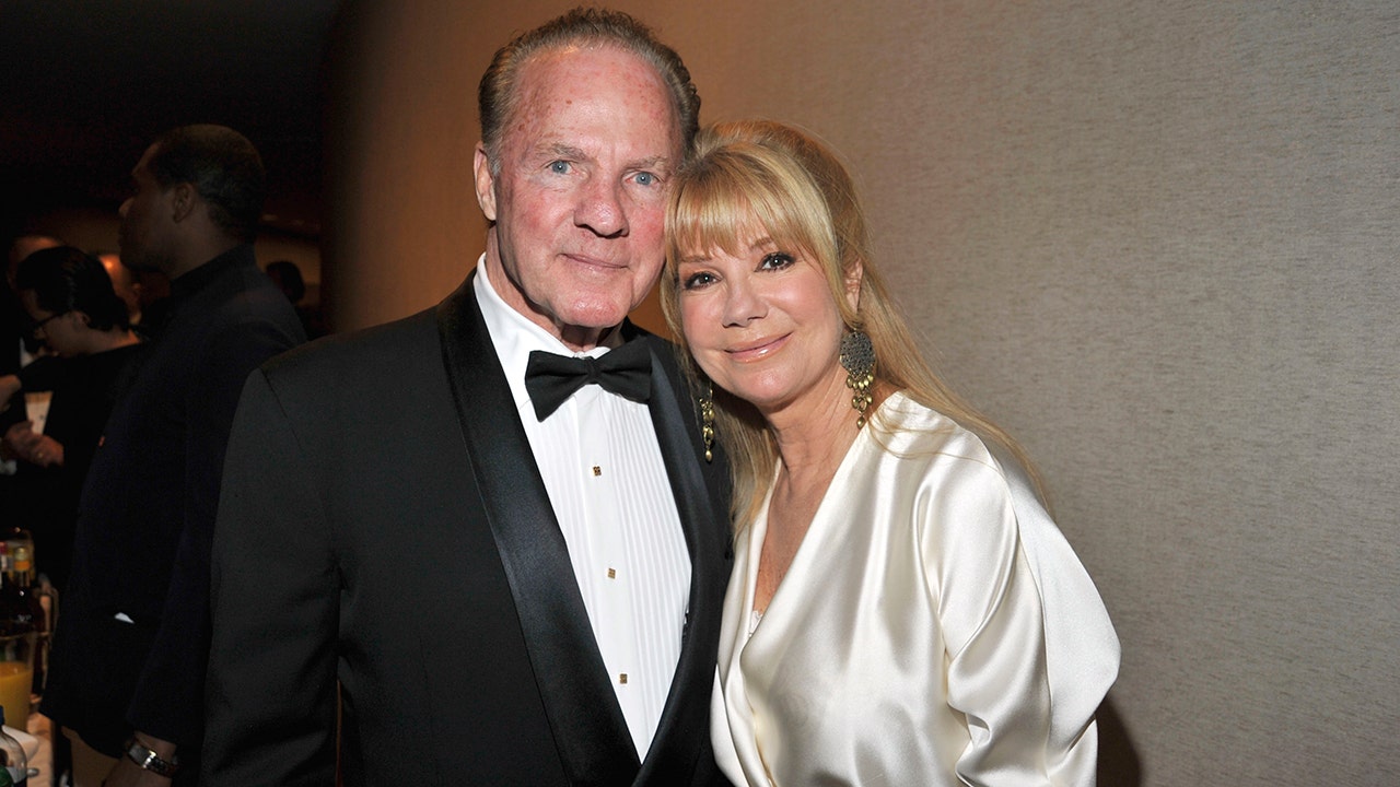 Frank Gifford and Kathie Lee Gifford standing together at the Literacy Partners Evening of Readings Gala in New York City