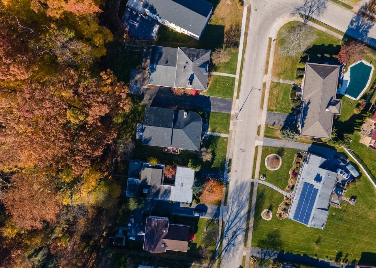 Aerial top down view of suburban multifamily homes in suburban Ardmore, Pennsylvania. -