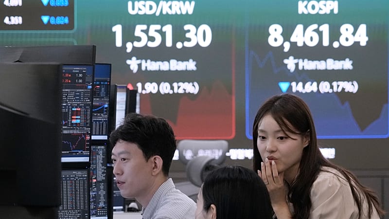 Asian stocks slide on chip sell-off as markets await US jobs data - AOL