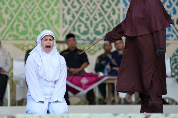 Woman passes out as she becomes first to be caned for ‘obscenity on social media’ under Sharia… Woman passes out as she becomes first to be caned for ‘obscenity on social media’ under Sharia…