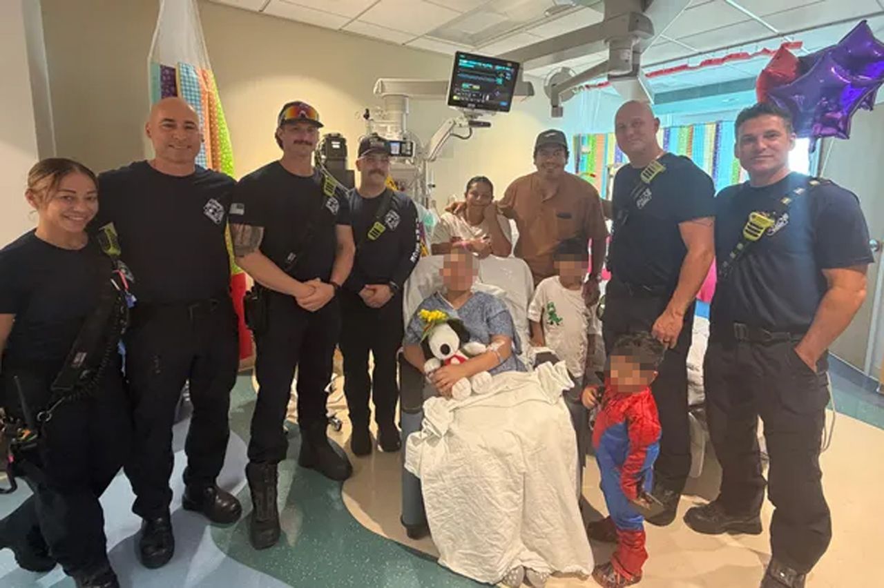 Dora Belen Rivera, her family and emergency service workers in the hospitalCredit: gofundme