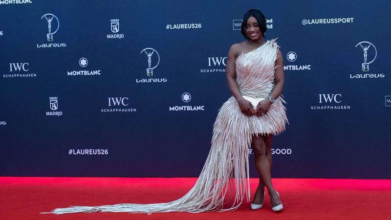 Simone Biles wore a red haute couture gown while attending the wedding with Jonathan Owens.MEGA