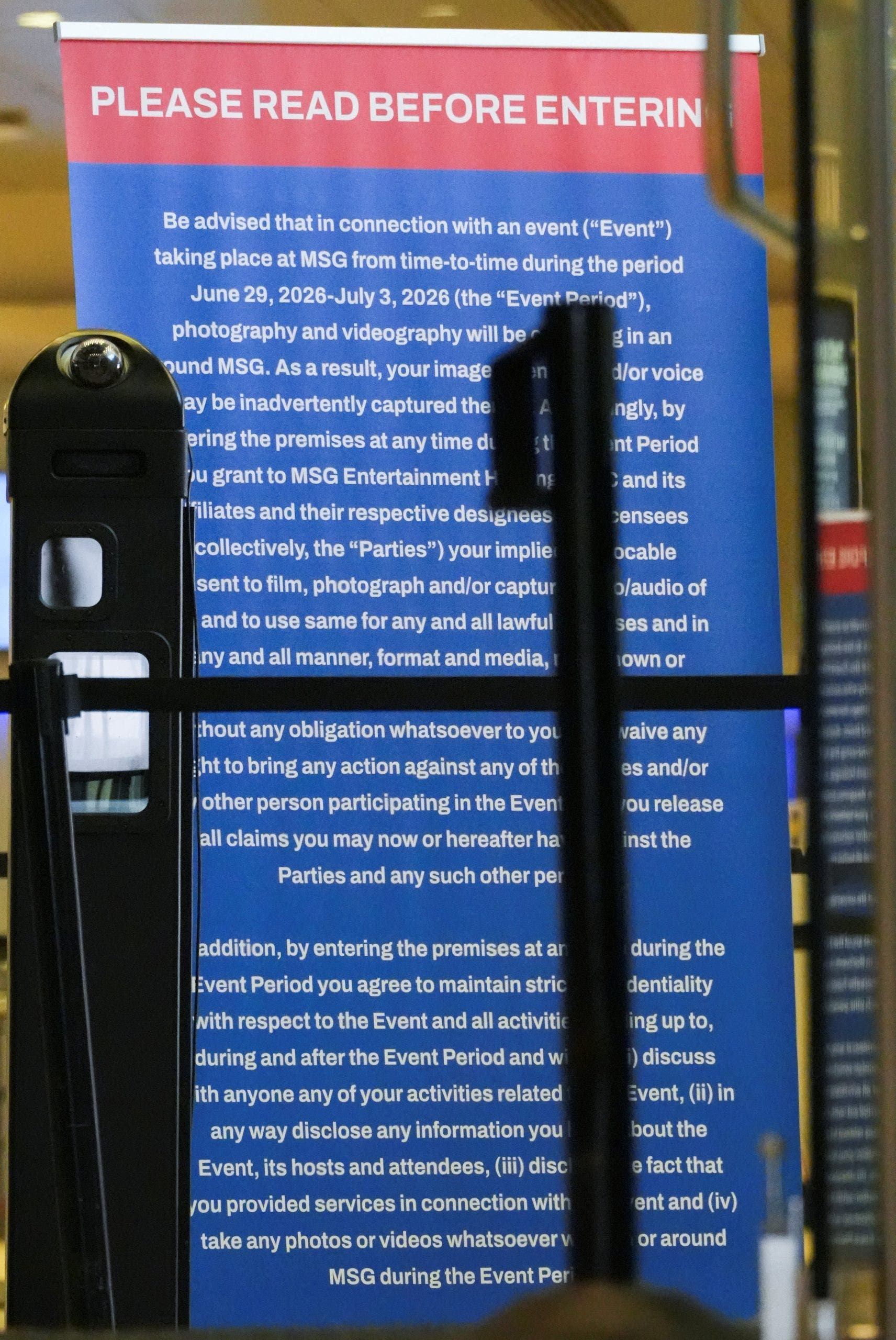 An information sign is displayed at one of the entries to Madison Square Garden as seen from outside