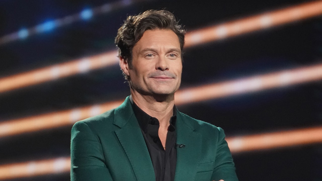 Ryan Seacrest smiling