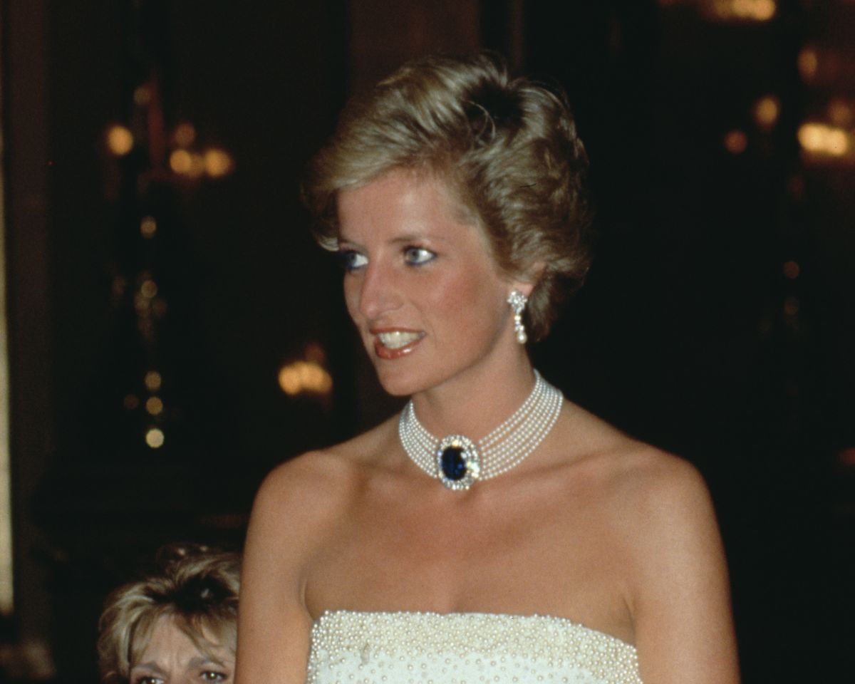 the dress diana wore after she became princess Princess Diana's star-spangled evening dress fetches record $1.148 million at auction
