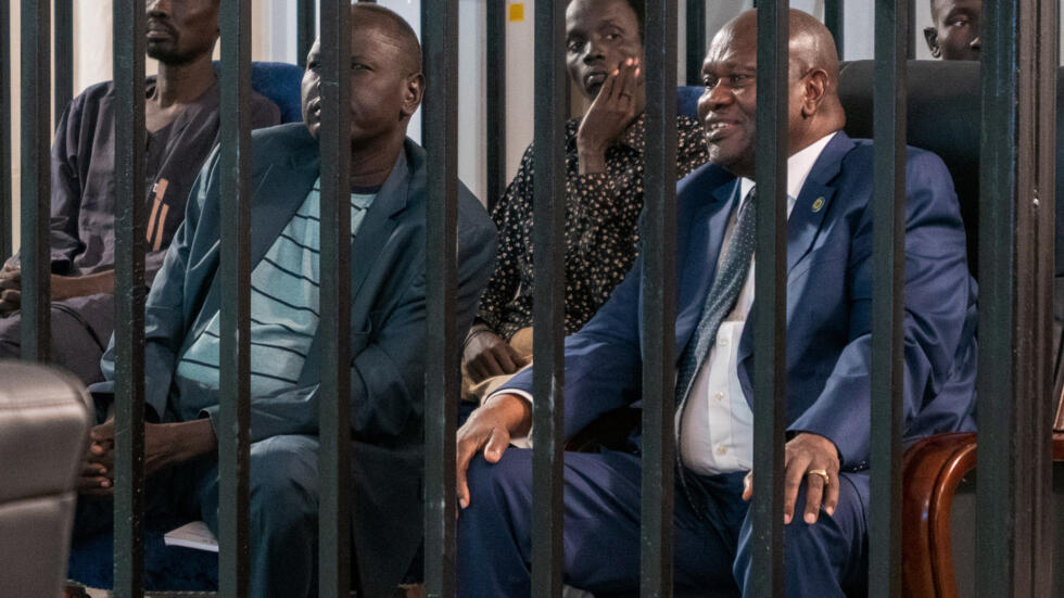 Machar sits in the dock with seven others charged with murder, treason, and crimes against humanity at Freedom Hall in Juba, 24 September, 2025.