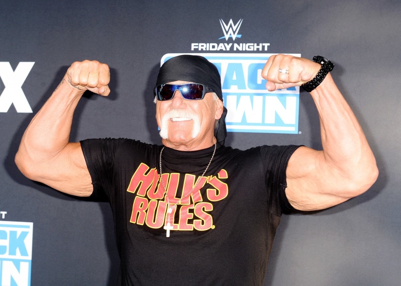 Hulk Hogan does a muscle pose at an event. - 