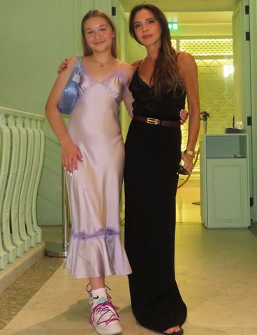 harper beckham pink dress Harper Beckham, 14, looks elegant in a pink satin camisole dress designed by mum Victoria as she attends Chelsea dinner party in honour of dad Sir David's knighthood