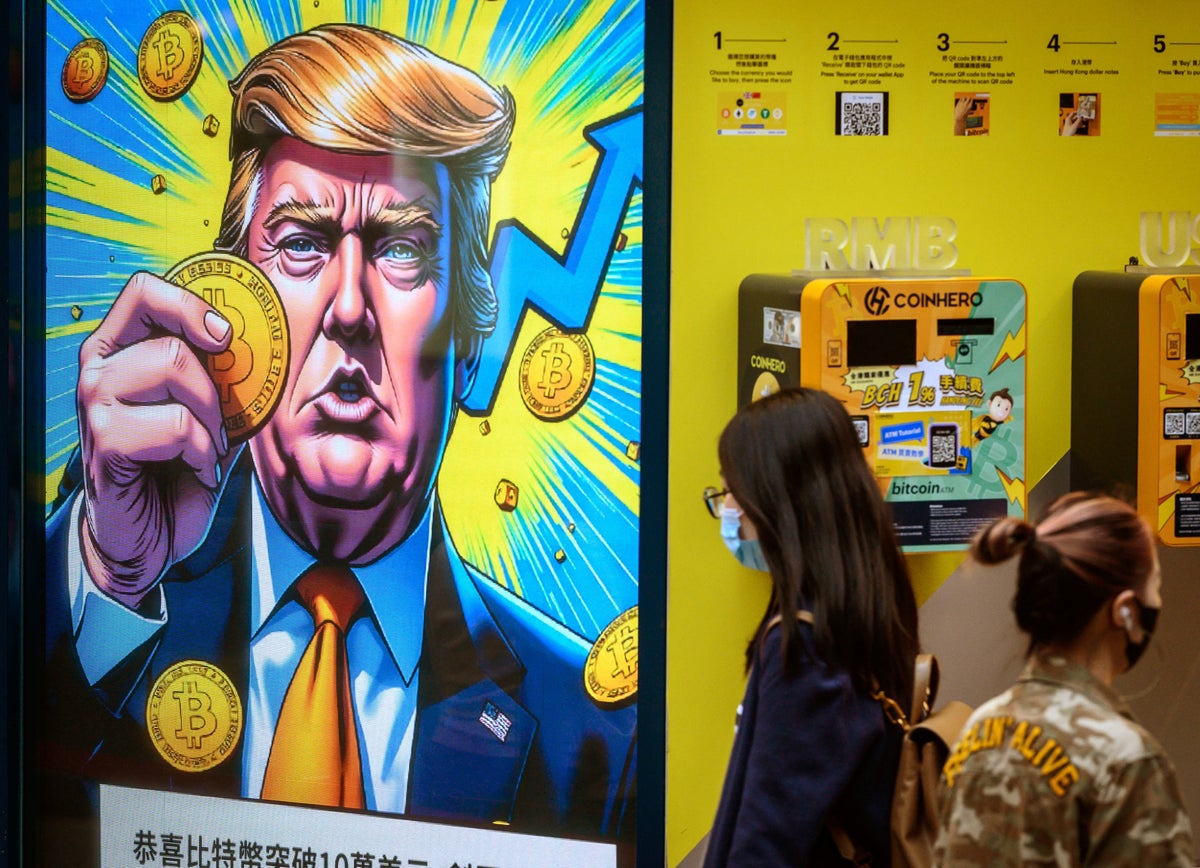 A crypto exchange office in Hong Kong with a screen featuring US President Donald Trump on March 12, 2025. (AFP via Getty Images)