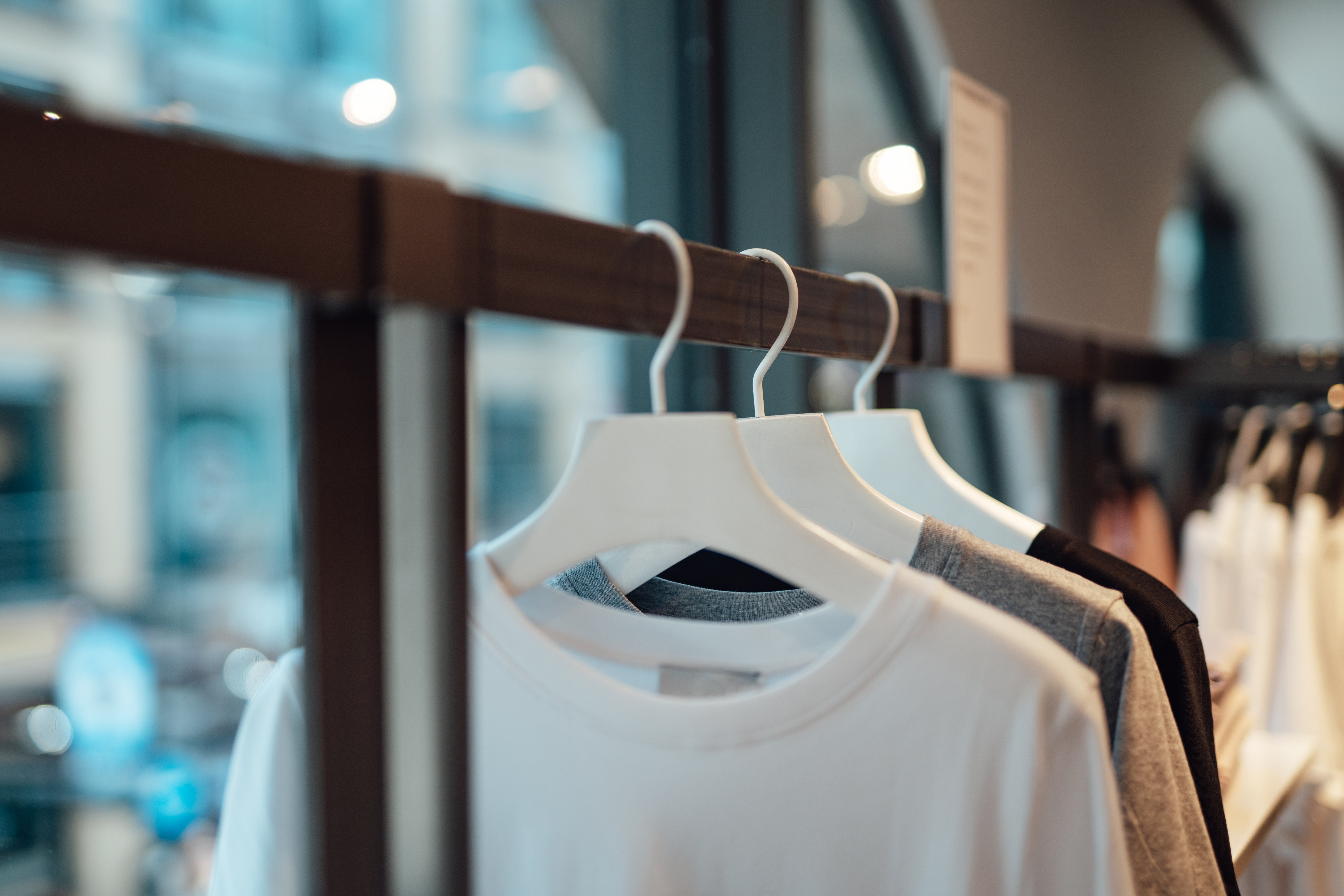 T-shirts on hangers displayed on a rack