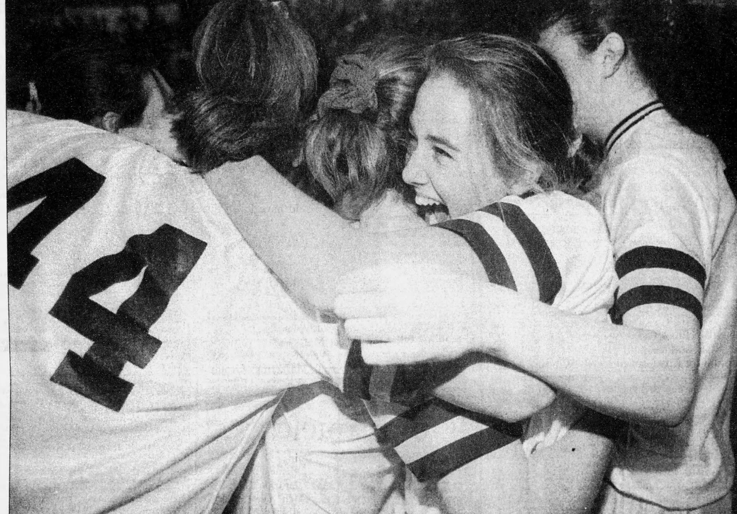 Essex players celebrate winning the 1996 Division I girls basketball crown.
