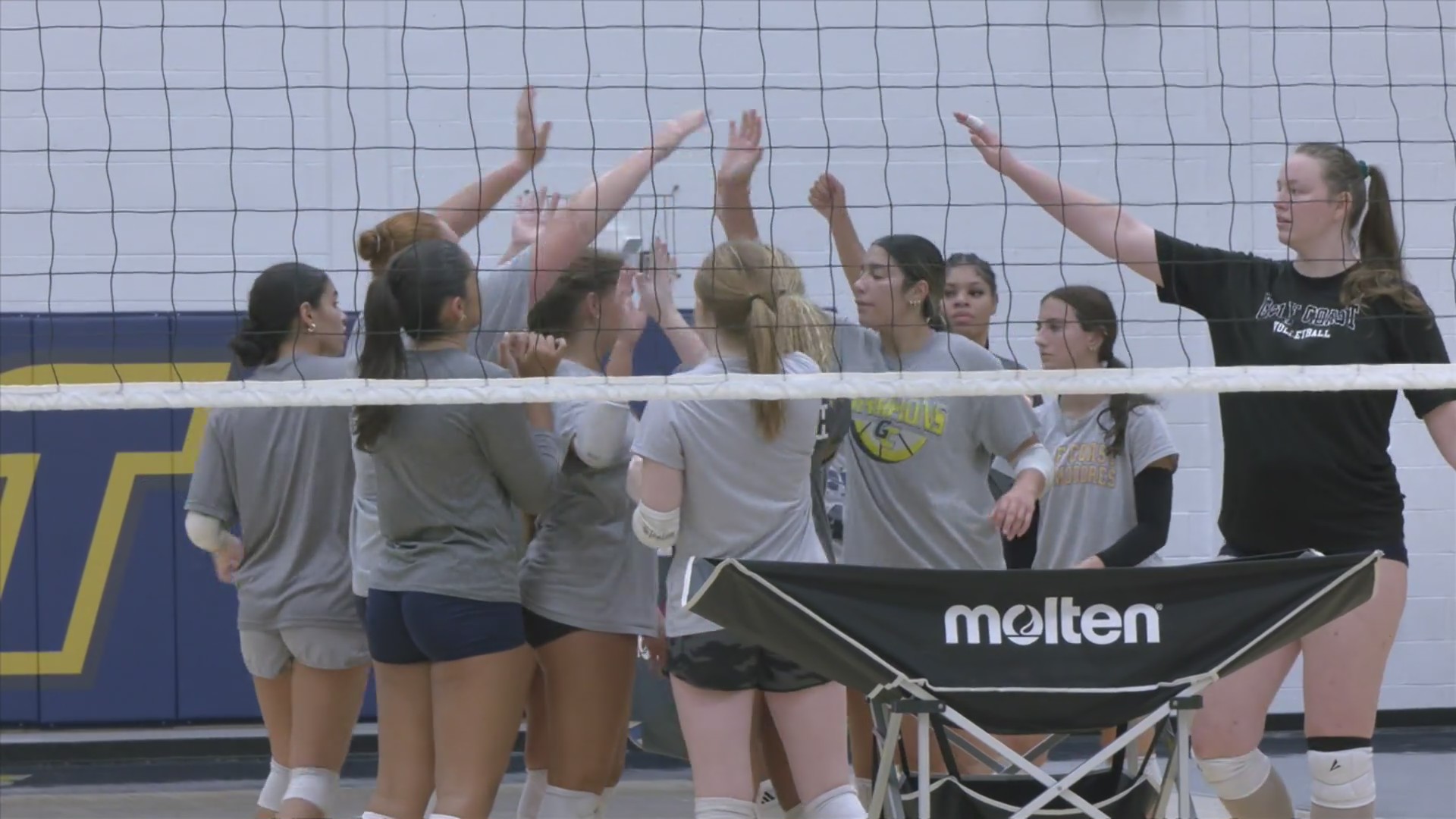 Gulf Coast State College volleyball head coach Scott Allen lays the ...