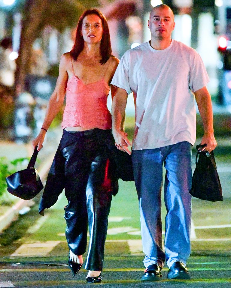 Katie Holmes is spotted getting close with artist Jason Bard Yarmosky while on a date night in New York City on July 21Credit: TheImageDirect.com