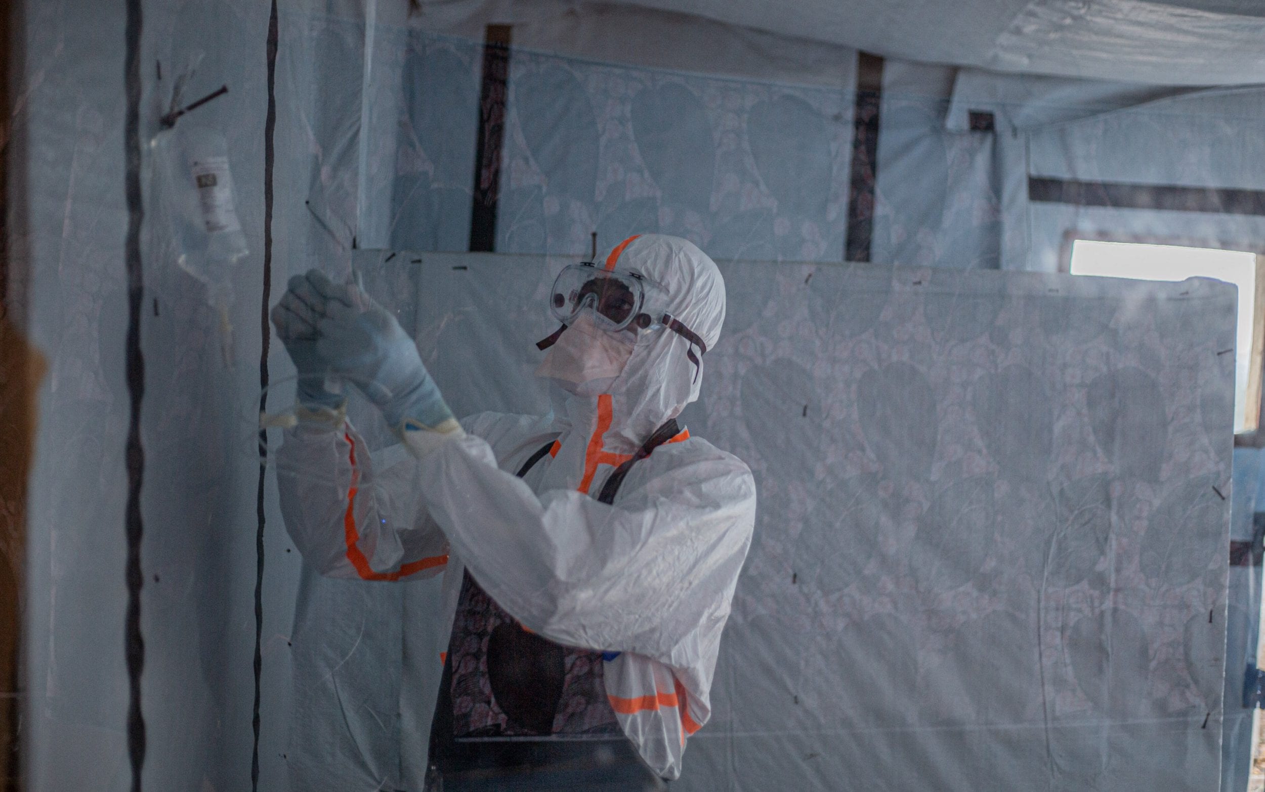 A doctor administers serum to a patient with Ebola virus disease at the Rwampara Ebola Treatment Centre (ETC) in Bunia, Ituri, in the east of the Democratic Republic of Congo on July 13, 2026
