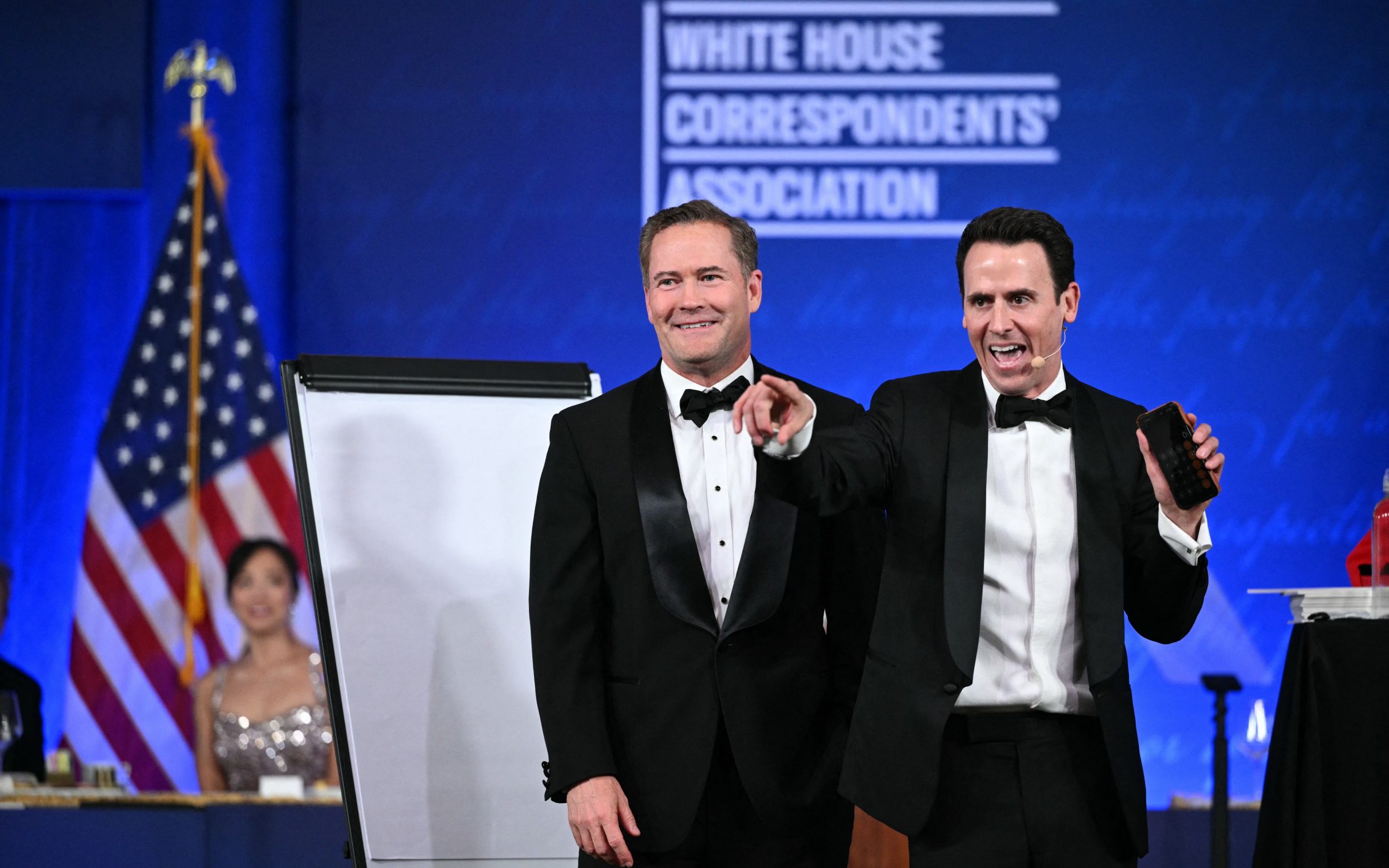 US Ambasador to the UN Mike Waltz takes part in an act with Oz 'Oz the Mentalist' Pearlman