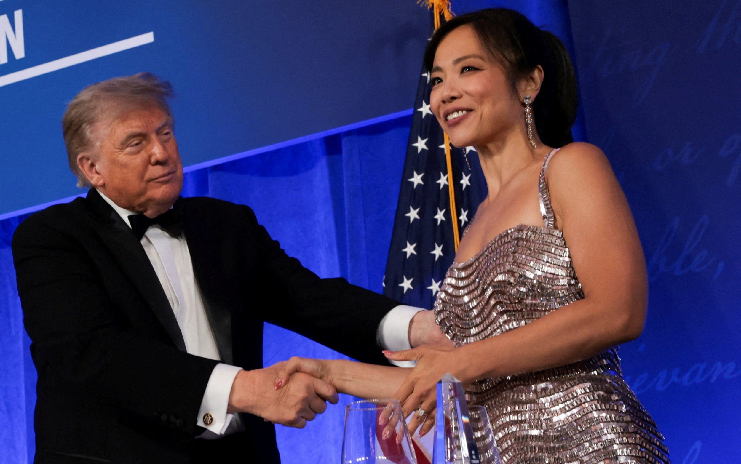 Donald Trump shakes hands with CBS News senior White House correspondent and White House Correspondents' Association (WHCA) President Weijia Jiang