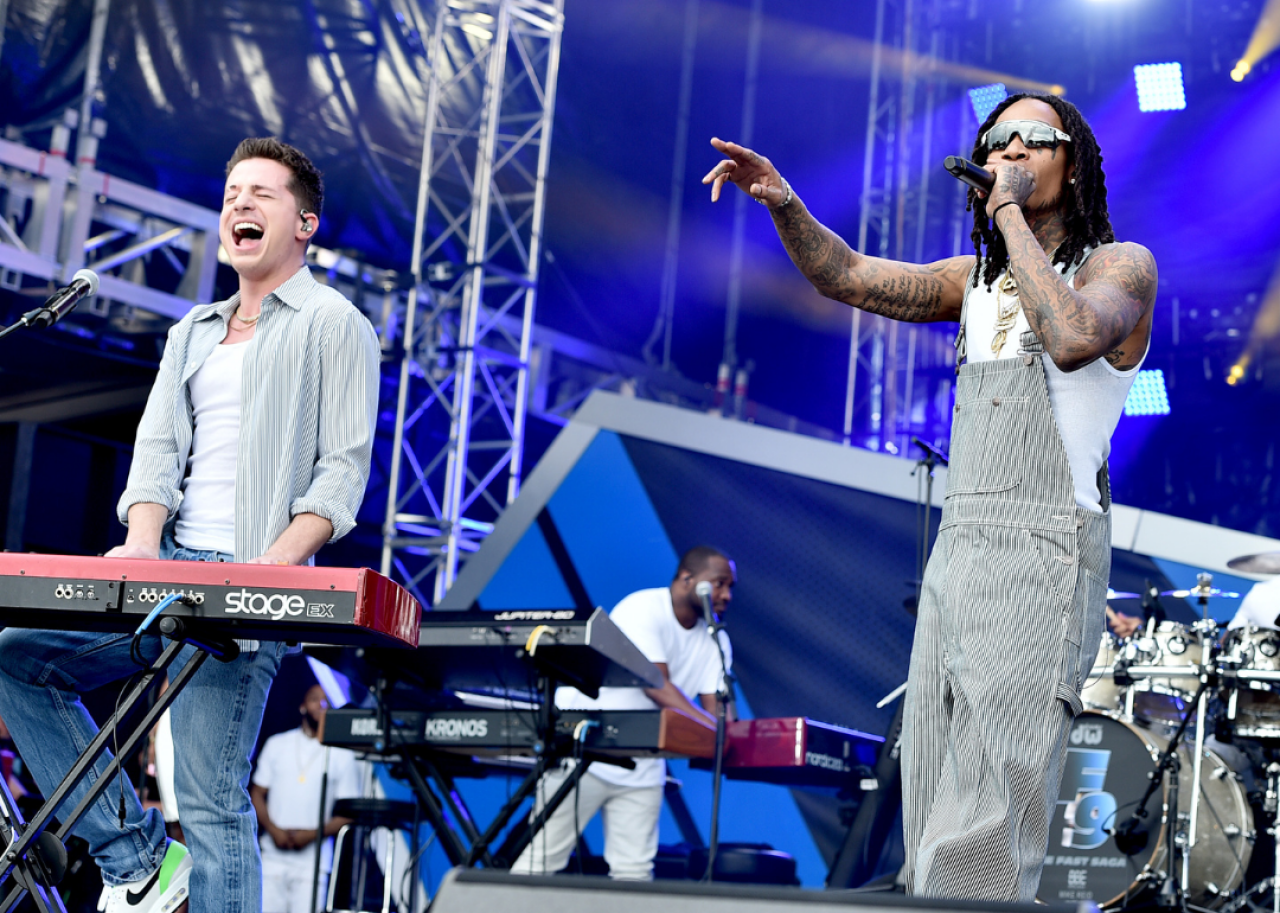 Wiz Khalifa and Charlie Puth performing. - 