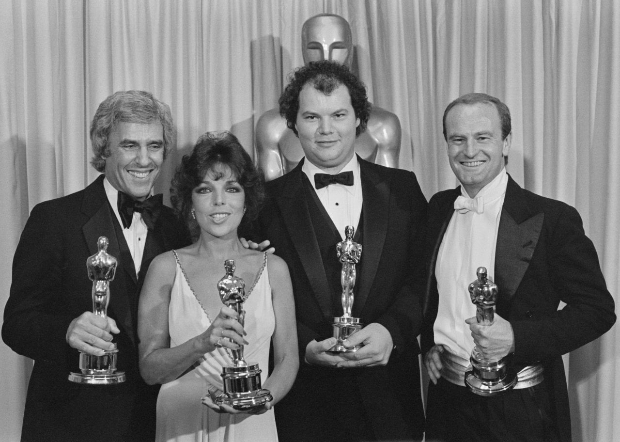 Burt Bachrach, Carole Bayer Sager, Christopher Cross, and Peter Allen holding their Oscars for the song from the movie Arthur, 1981. - 