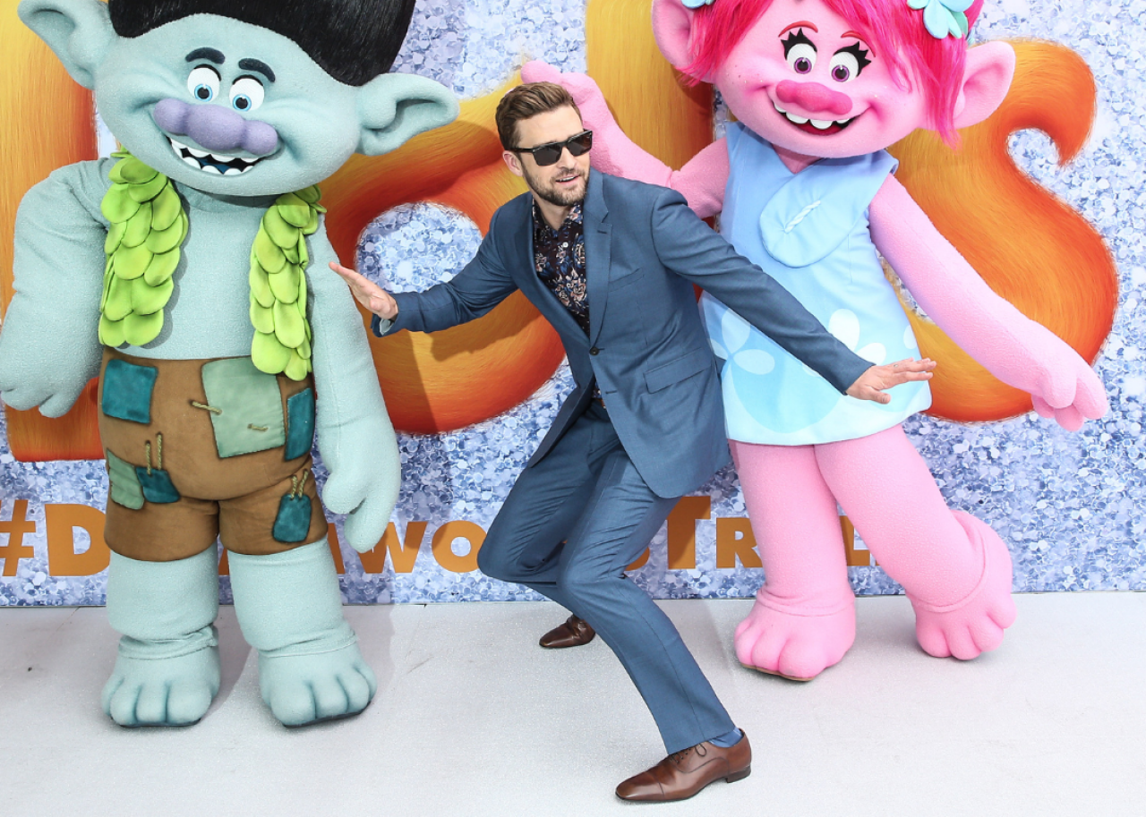 Justin Timberlake posing with Trolls characters. - 