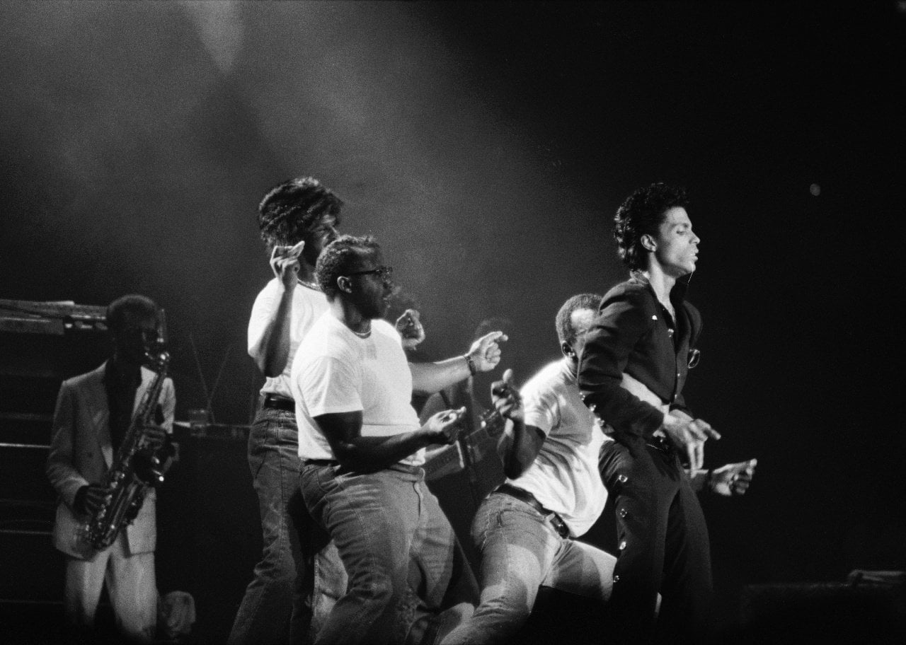 Prince performing onstage. - 