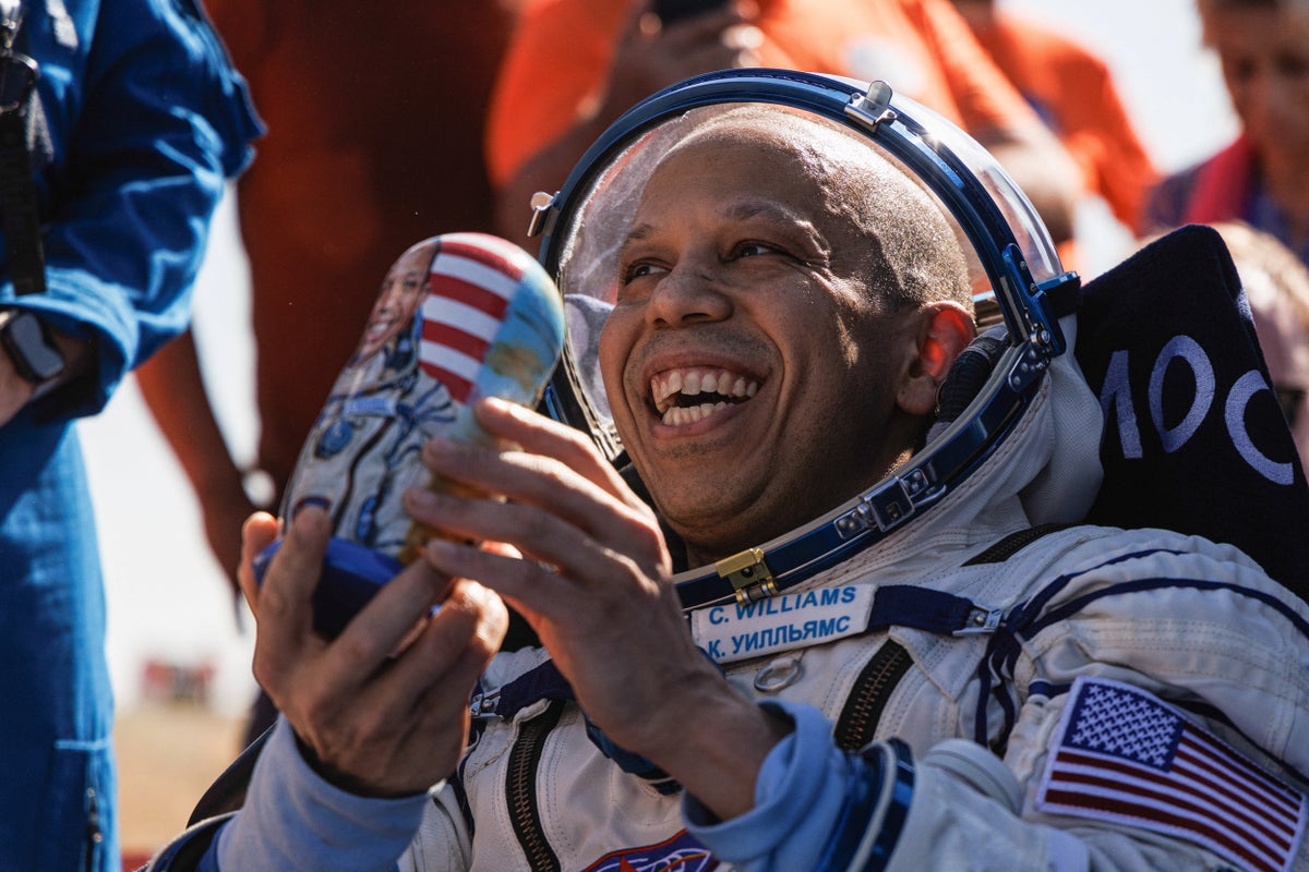 Russia sends American and two cosmonauts to space station with