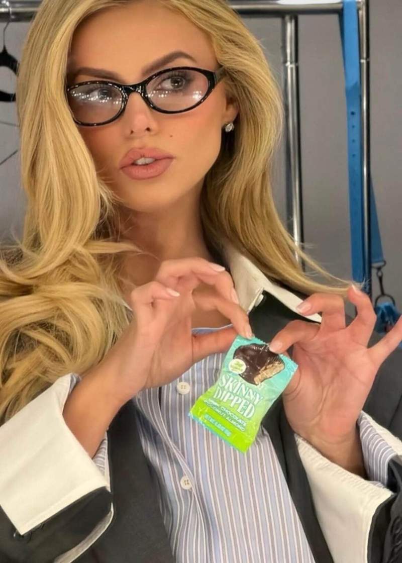 SkinnyDipped brand ambassador Brooks Nader keeps her favorite SkinnyDipped Dark Chocolate Coconut Almond Bites close by for the perfect on-set snack in L.A on July 21. Credit: SkinnyDipped