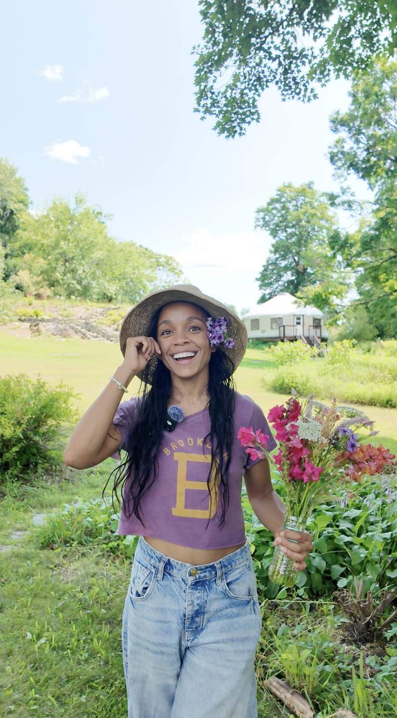 Last Thursday, actress Rachel Hilson joined global nonprofit WhyHunger at Rock Steady Farm to see their efforts in action during Donor Volunteer Day. The day offered a hands-on look at food justice in action, with Hilson working alongside the queer- and trans-led, multiracial worker cooperative, which grows culturally meaningful food, expands food access, and supports QTBIPOC farmers. Credit: Why Hunger