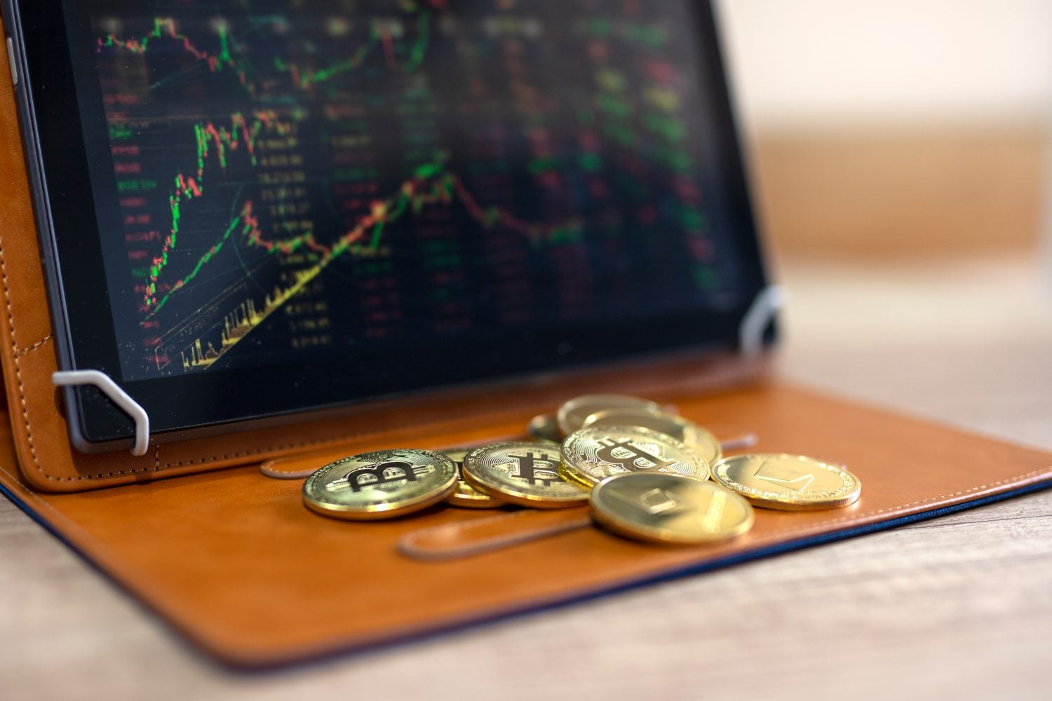 Crypto currency bitcoin and ethereum market on tablet with stock graph