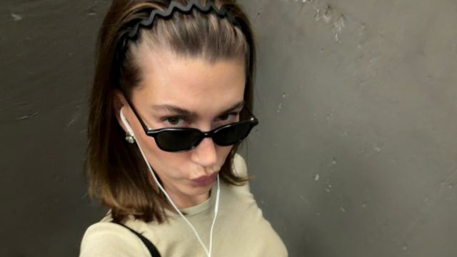 Hailey Bieber Leaves Her White Shirt Wide Open in a Head-Turning Summer Photo