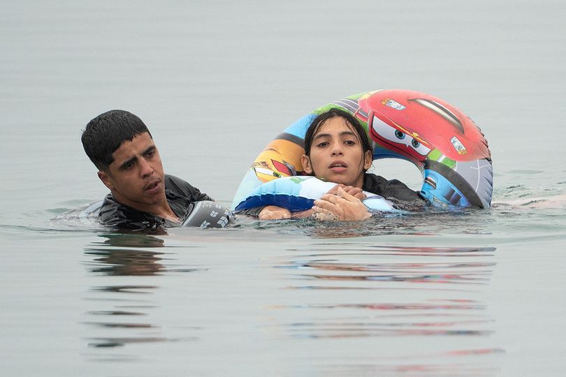 Woman's desperate bid for land clinging to child's inflatable as 60,000  migrants enter Ceuta in border crisis - AOL