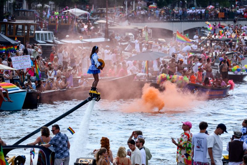 Thousands in Amsterdam for boisterous WorldPride in shadow of Berlin attack...