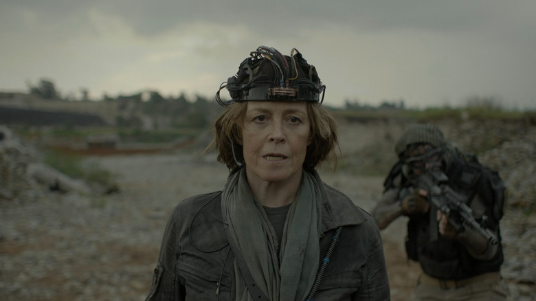 Jasper wearing a helmet in a battlefield on Oats Studios
