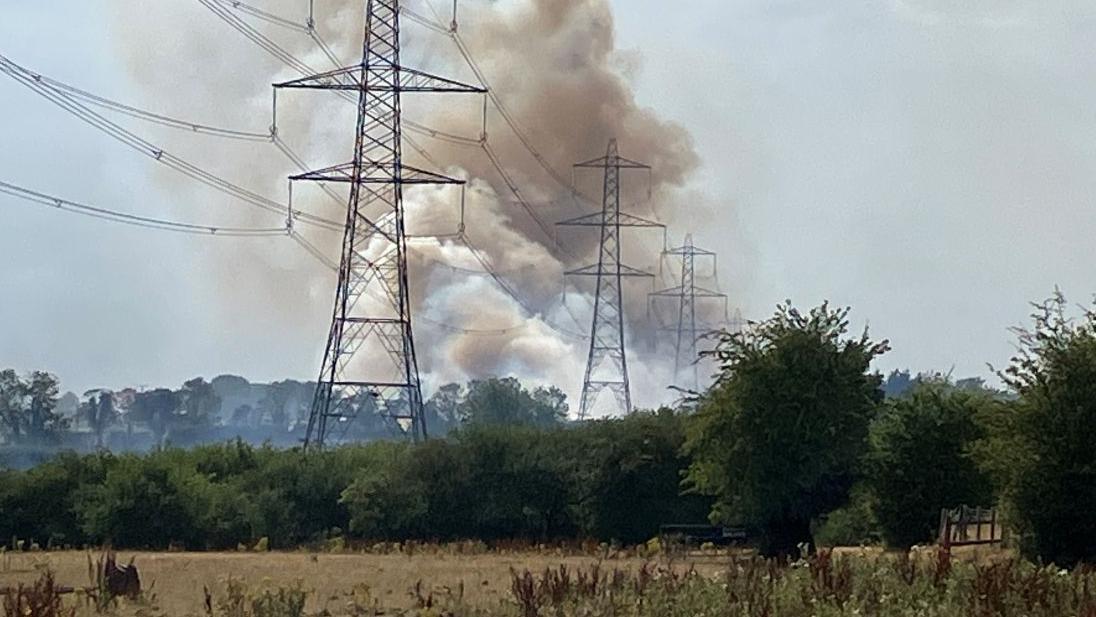 Smoke warning as crews tackle grass fire