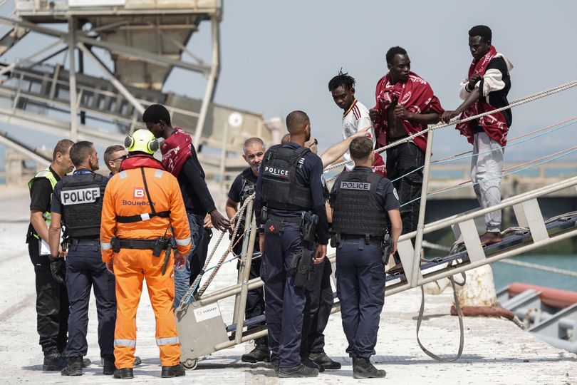 English Channel horror as 157 migrants capsize on flaming boat with France and UK launching rescue mission