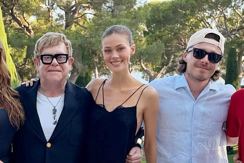 Nicola Peltz cosies up to Beckham mediator Elton John as David and Victoria out in cold