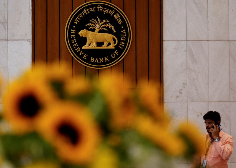 India's central bank holds rates, awaits clearer inflation signal before acting