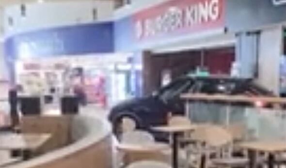 Brazen thieves plough through service station in car in shocking clip