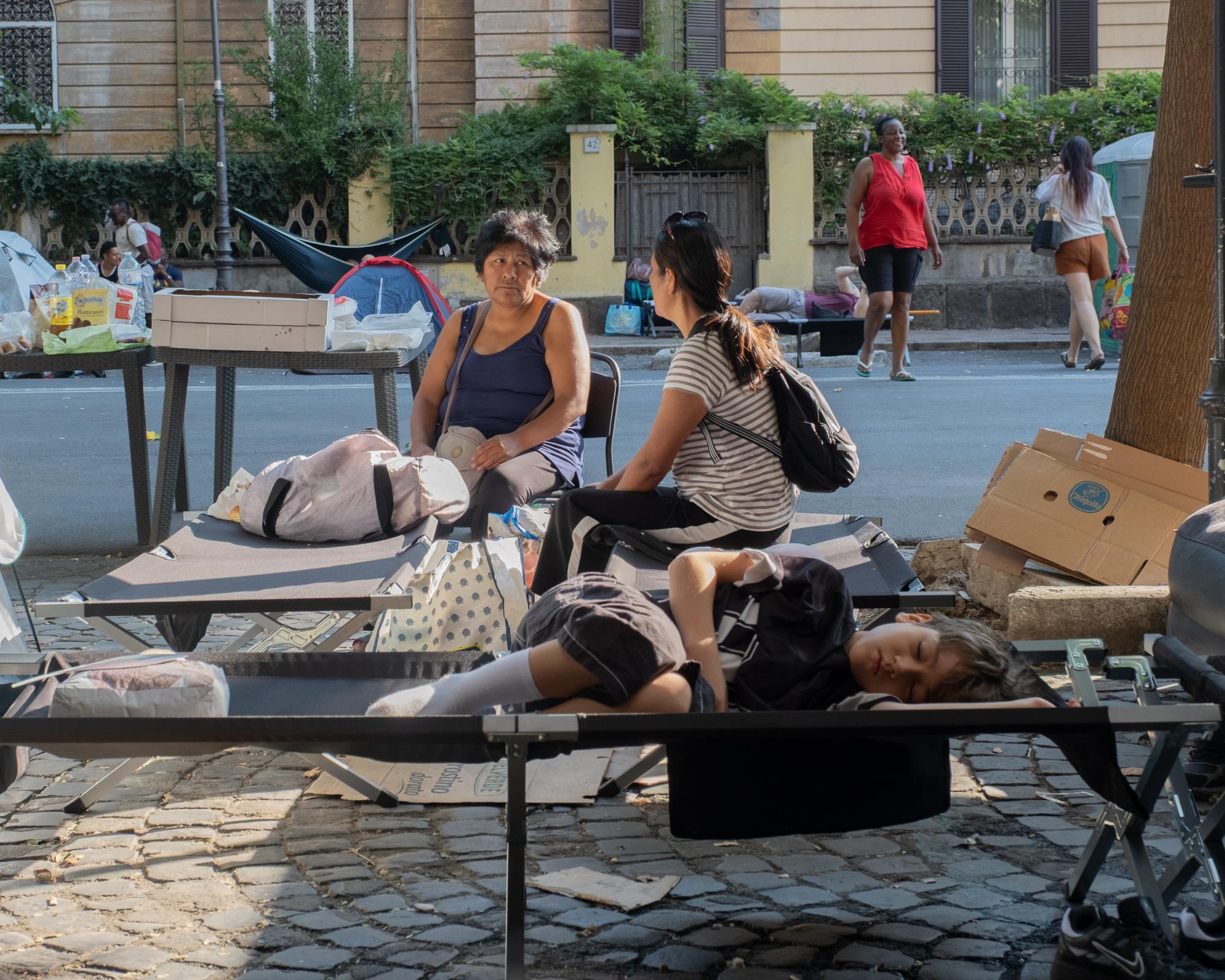 Scramble to house hundreds camping in Rome heatwave after squat eviction