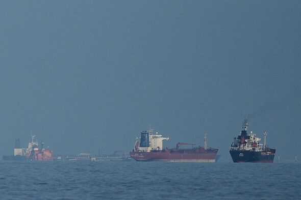Oil tankers and cargo ships lining up in the Strait of Hormuz