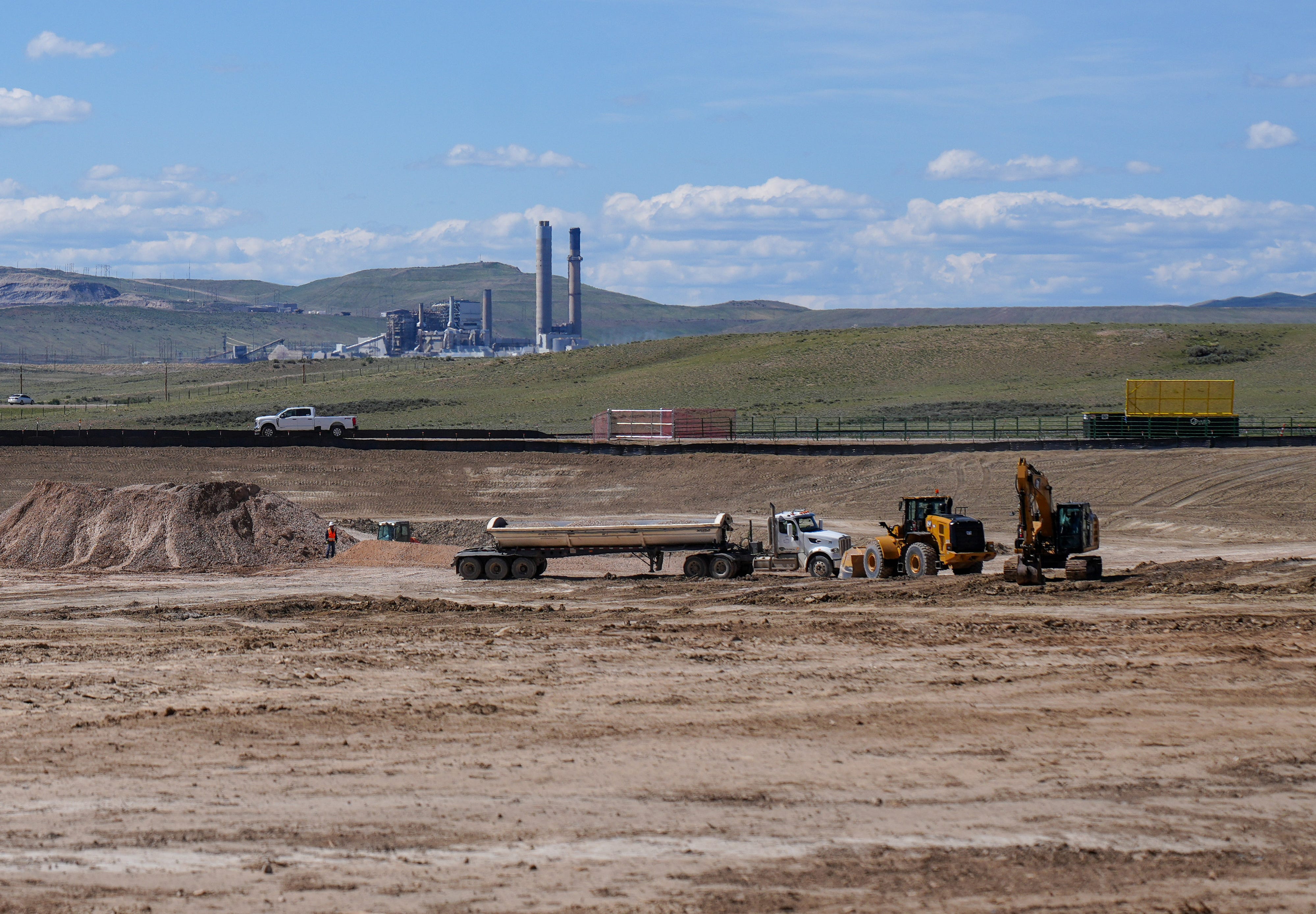 With the formerly coal-fired Naughton power plant in the background, workers at TerraPower’s Kemmerer Unit 1 prepare the site of the company’s new small-scale nuclear power plant being built in southwestern Wyoming, in a photo taken in May 2026. The Naughton power plant is now powered by natural gas.